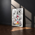 Hisoka Morow manga poster inspired by Hunter x Hunter in a black frame against a charcoal gray wall