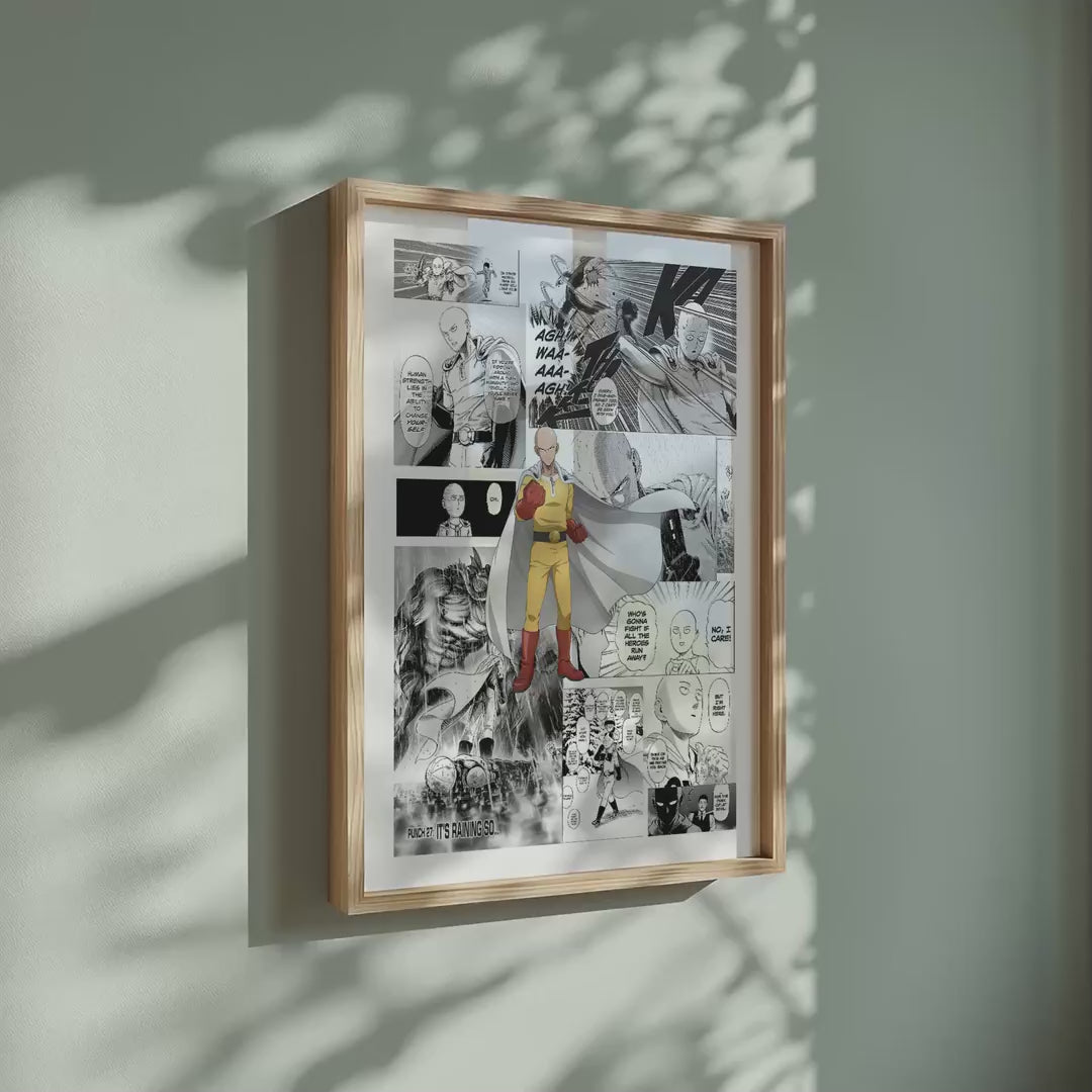 Video of the Saitama manga poster inspired by One-Punch Man in a light wood frame on a sage green wall
