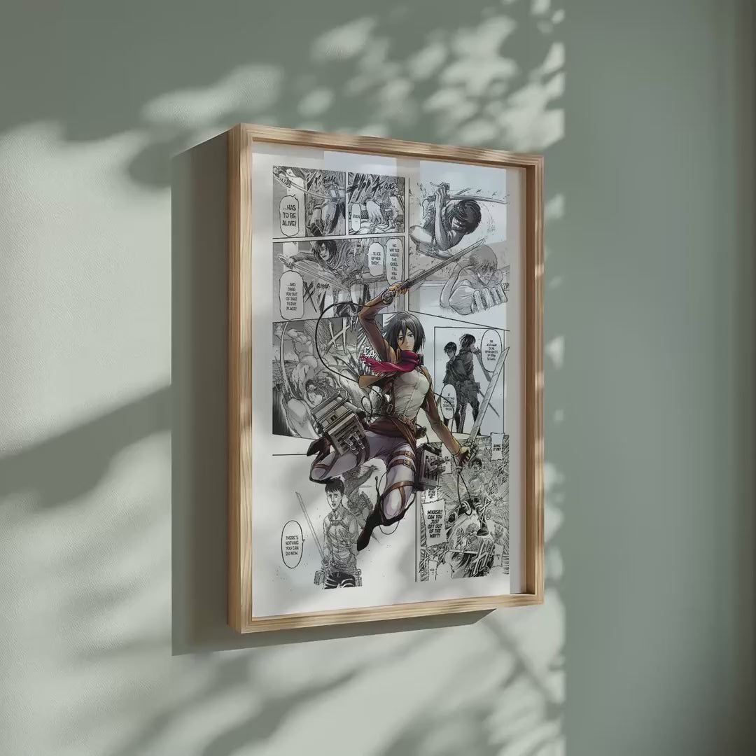 Video of the Mikasa Ackerman manga poster inspired by Attack on Titan in a light wood frame on a sage green wall