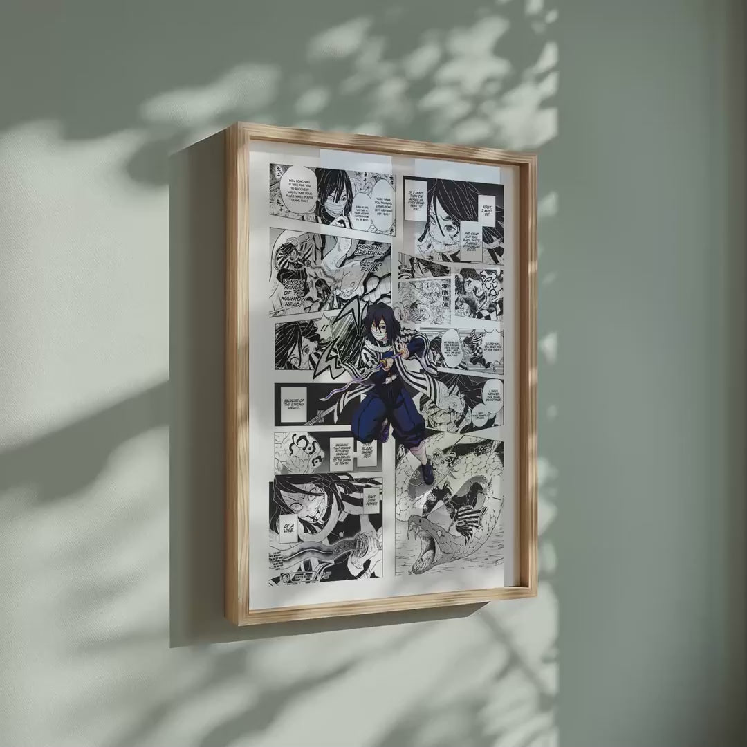 Video of the Obanai Iguro manga poster inspired by Demon Slayer in a light wood frame on a sage green wall