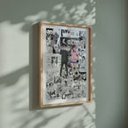 Video of the Momo and Okarun manga poster inspired by Dandadan in a light wood frame on a sage green wall