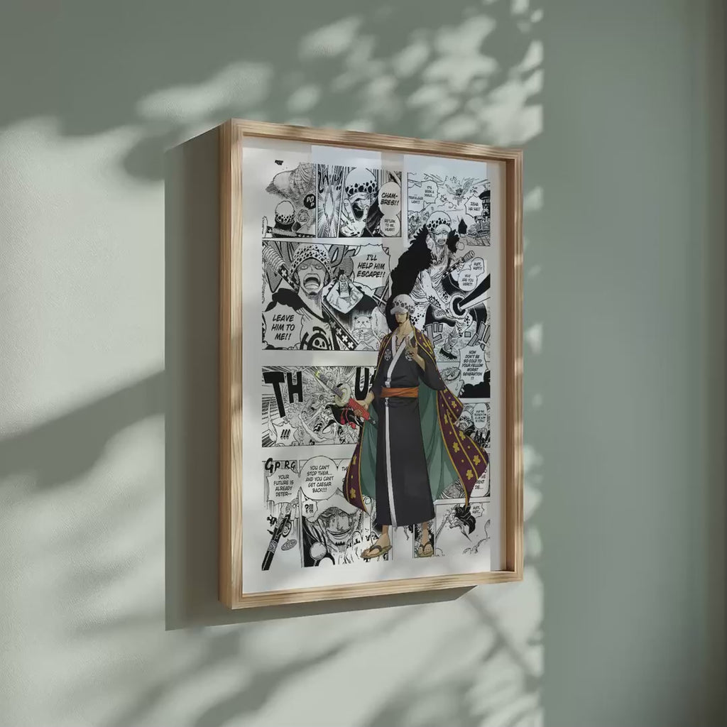 Video of the Trafalgar D. Water Law manga poster inspired by One Piece in a light wood frame on a sage green wall