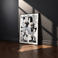 Satoru Gojo Shinjuku Showdown manga poster inspired by Jujutsu Kaisen in a black frame against a charcoal gray wall